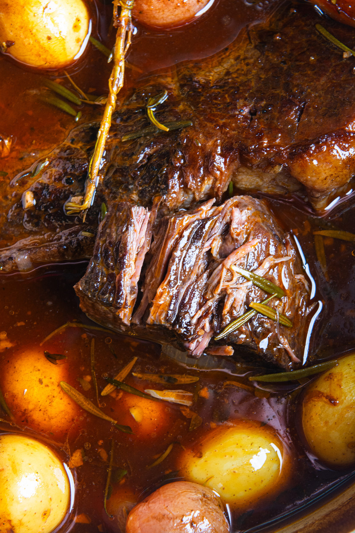 A hot pot roast, baby potatoes, and carrots, cooked in beef stock and wine.