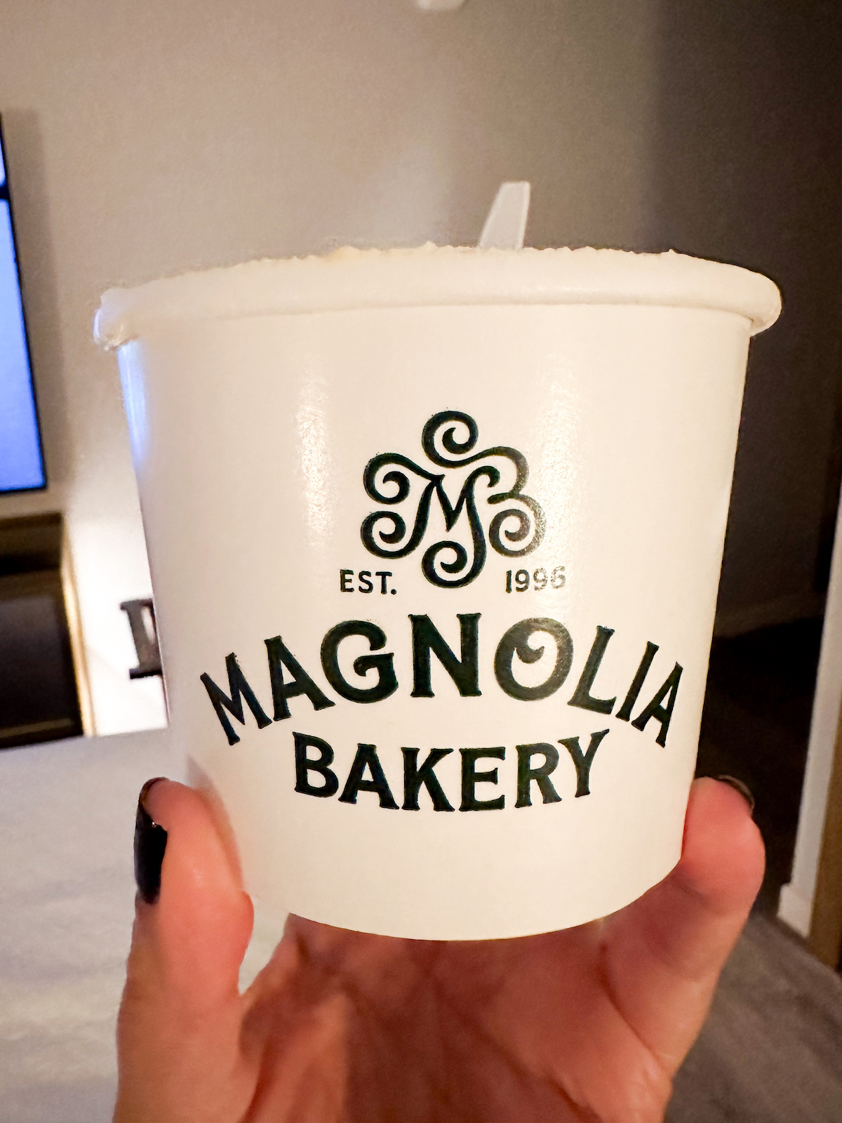 A cup of Magnolia Bakery's Banana Pudding with their name and logo.