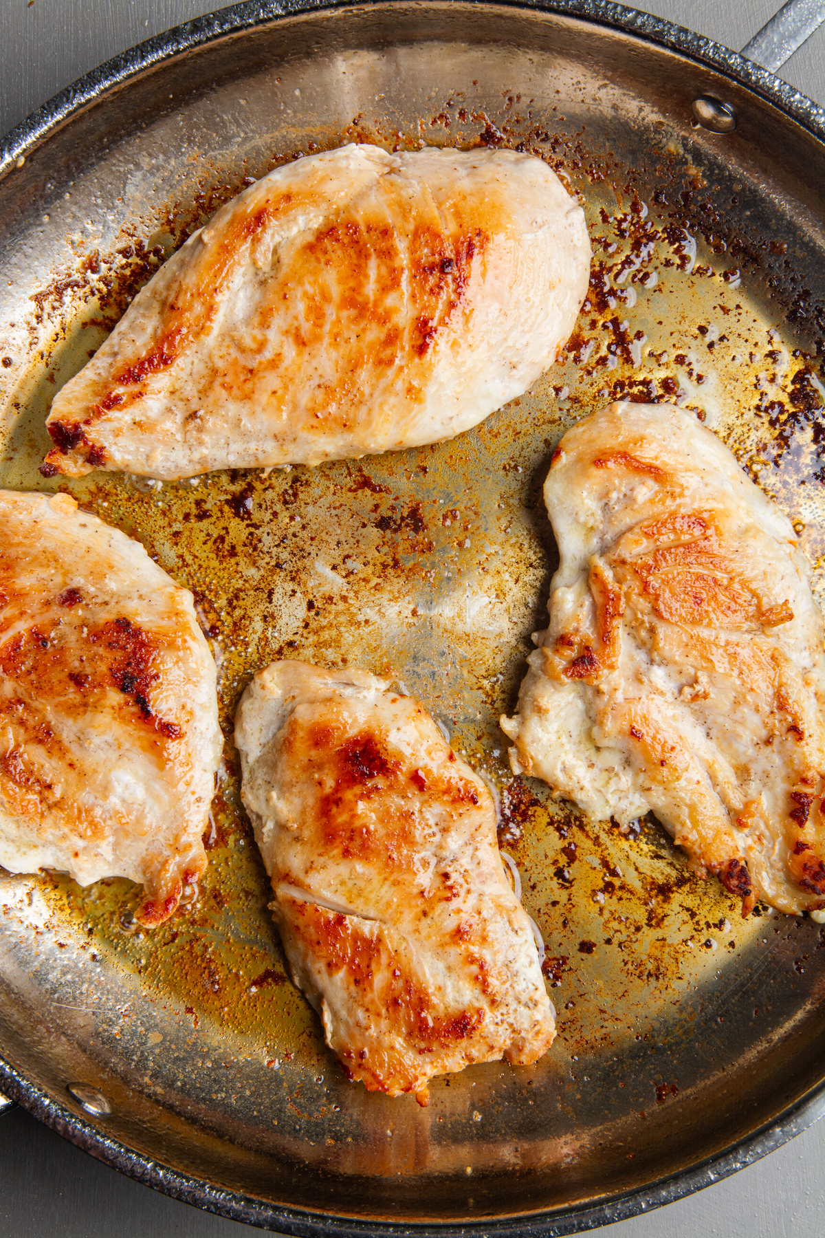 Sautéed chicken breasts in butter and olive oil.