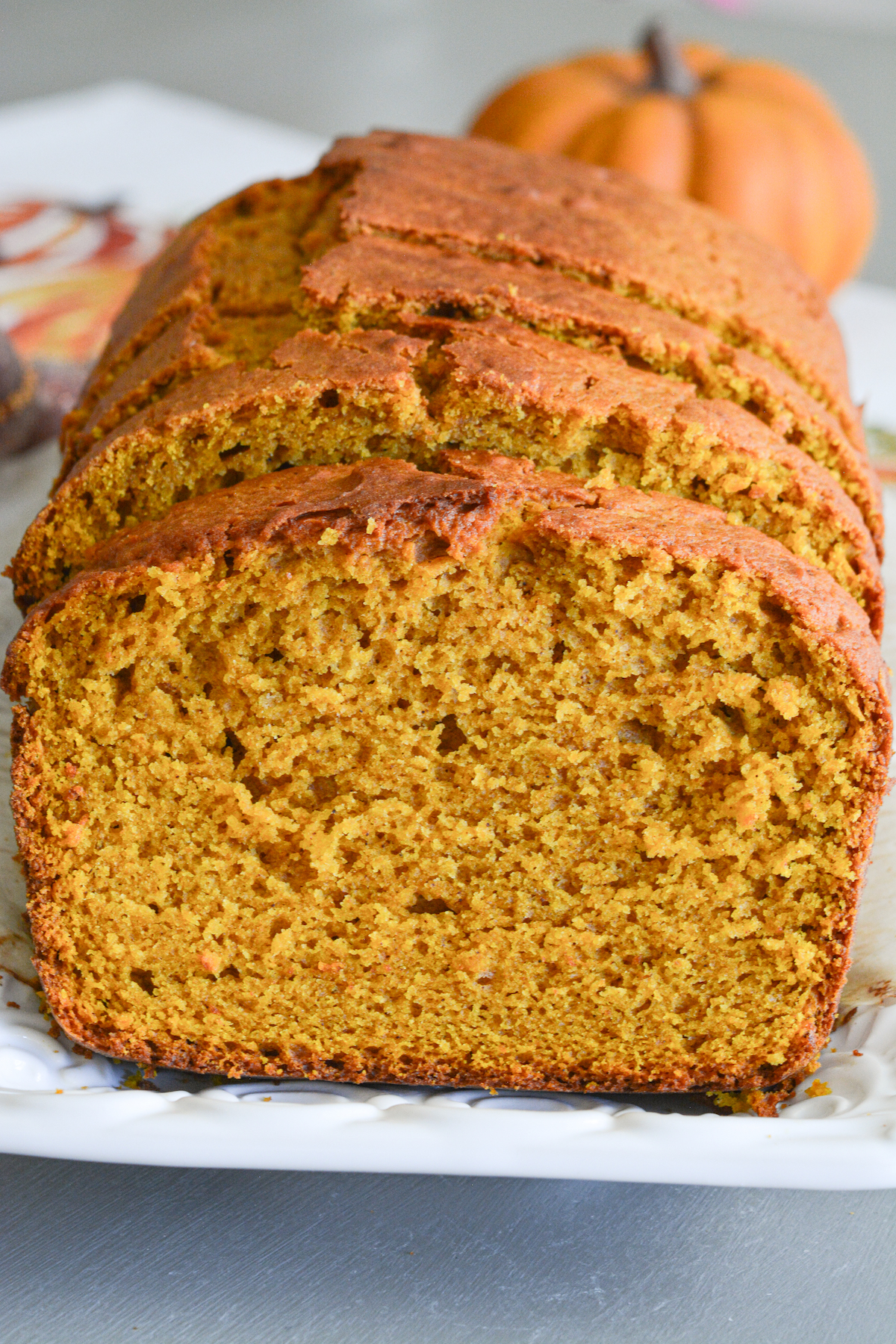 A loaf of pumpkin bread cut into slices