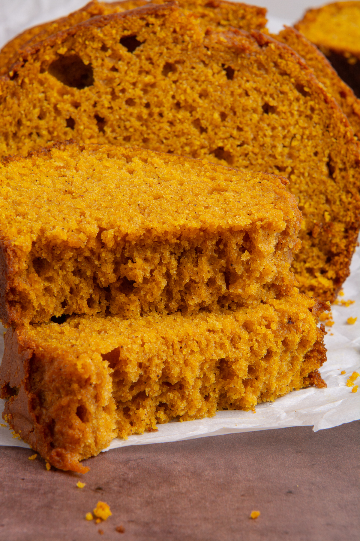 A slice of pumpkin bread cut in half.