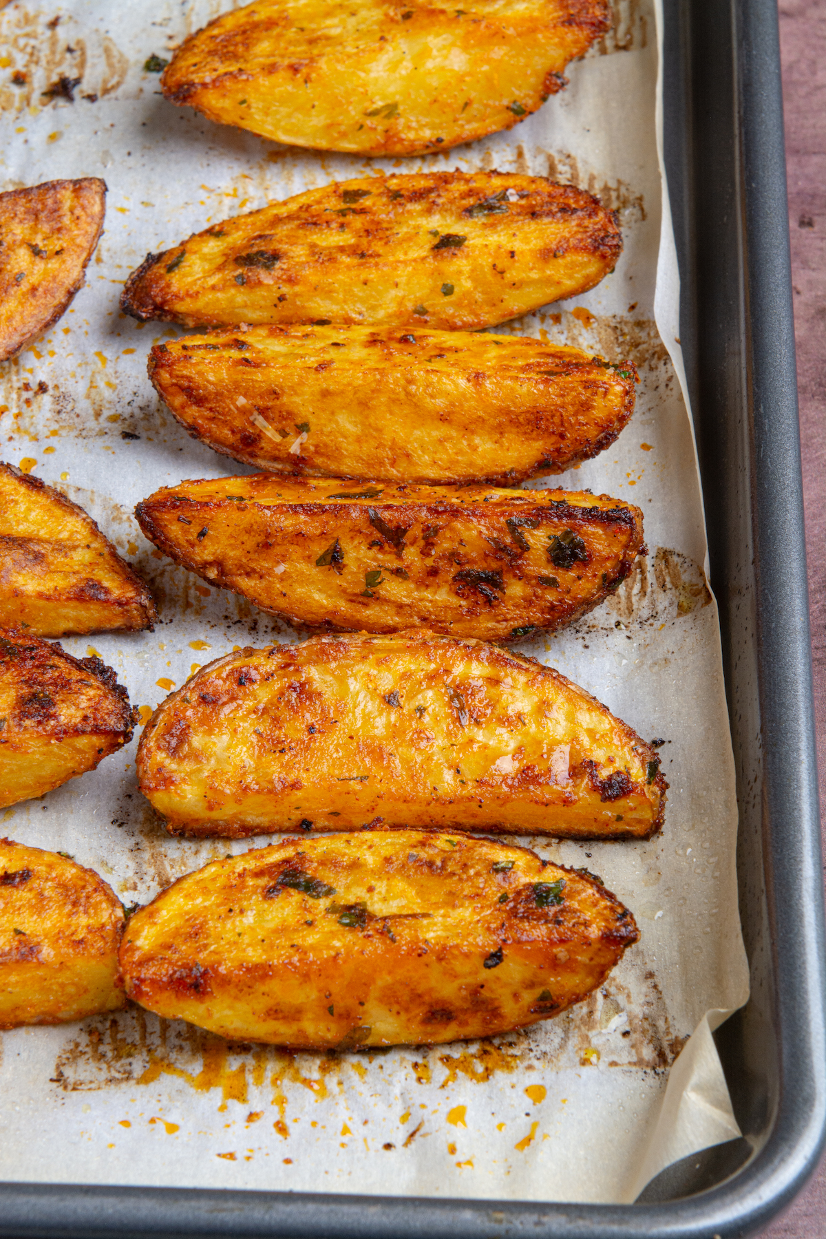 A baking sheet with oven baked potato wedges