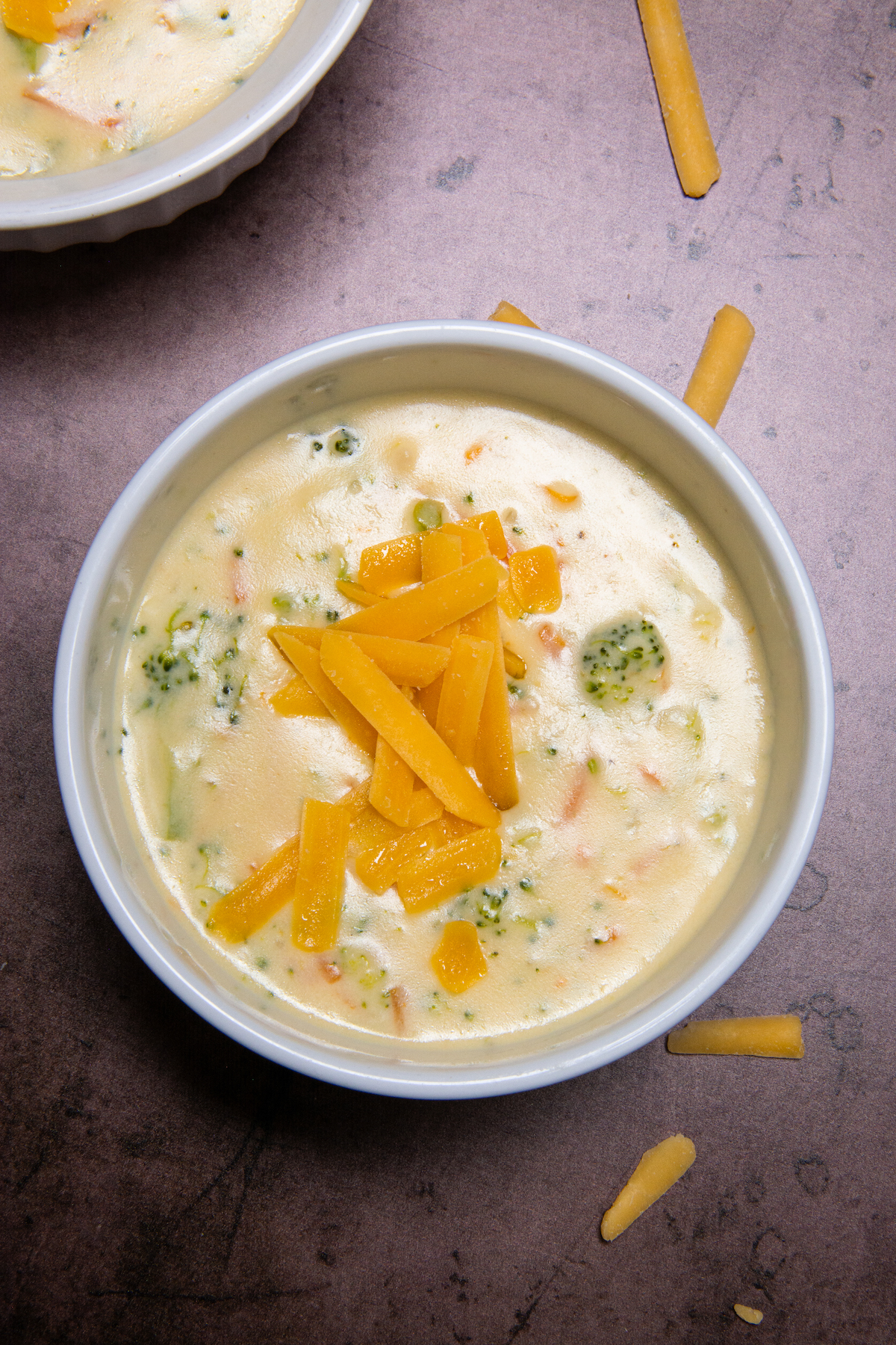 A bowl with broccoli cheddar soup.