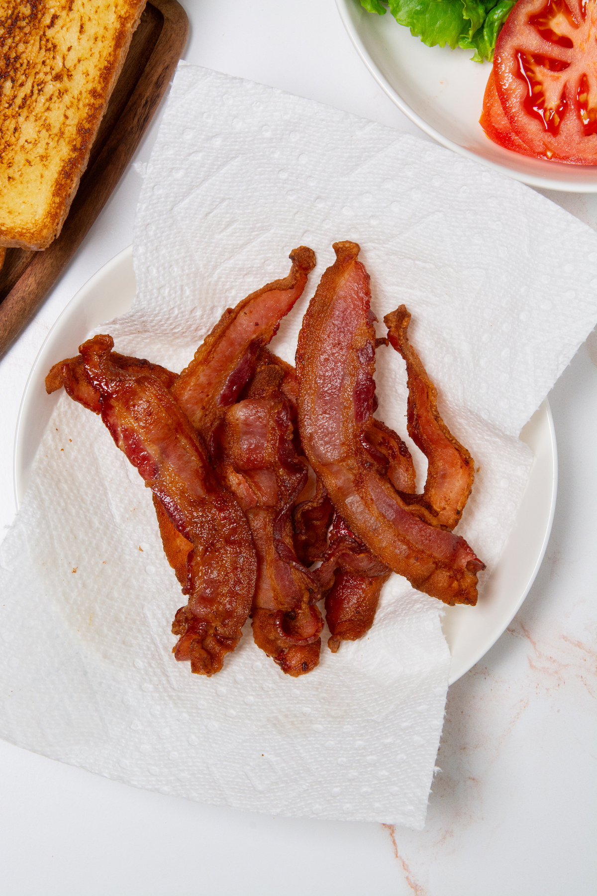 A plate with crispy air fryer bacon.