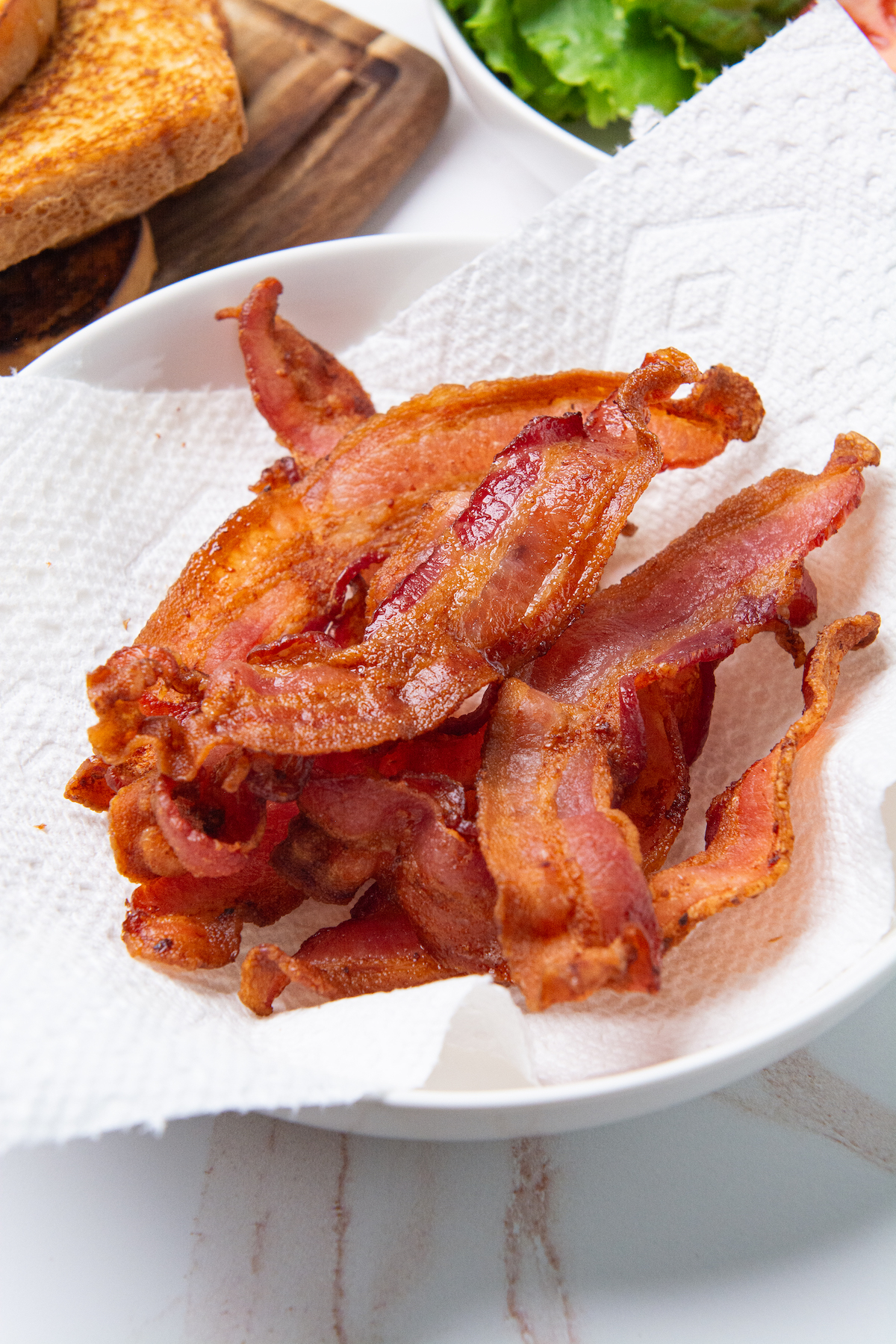 A plate with crispy air fryer bacon.