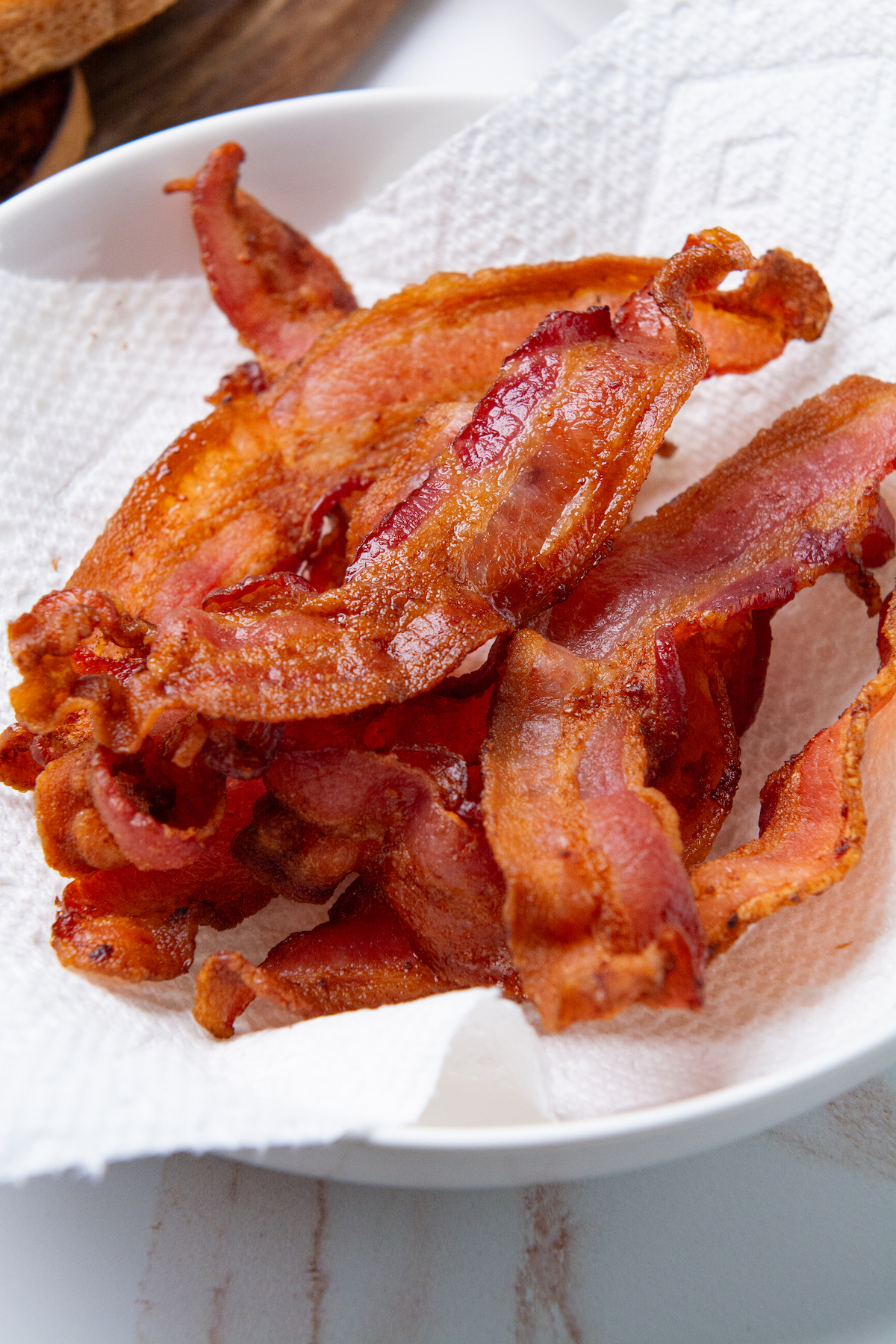A plate with crispy air fryer bacon.