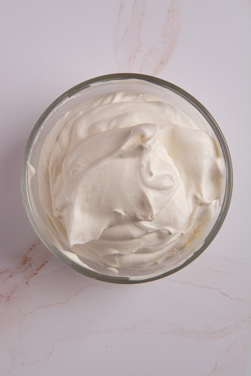 A bowl of fresh, homemade whipped cream.