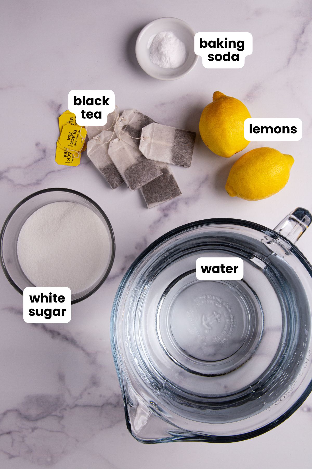List of ingredients for sweet iced tea which include: Water, black tea, white sugar, baking soda, and lemons.
